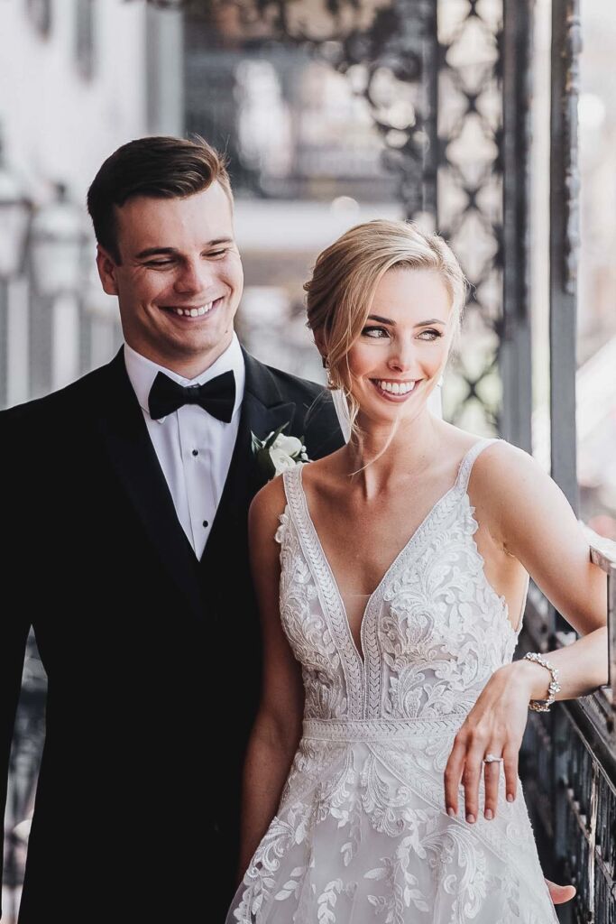 bride and groom on balcony new orleans