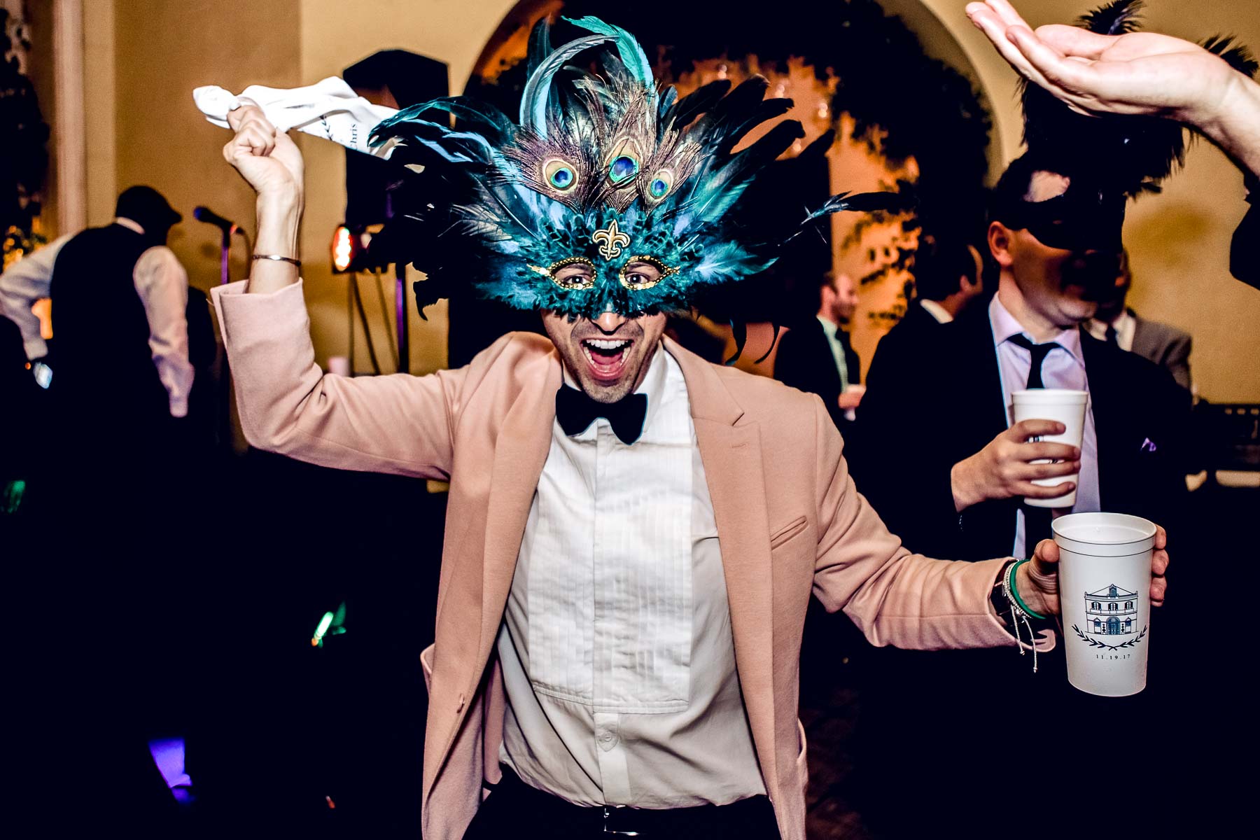 New Orleans wedding guest with mask