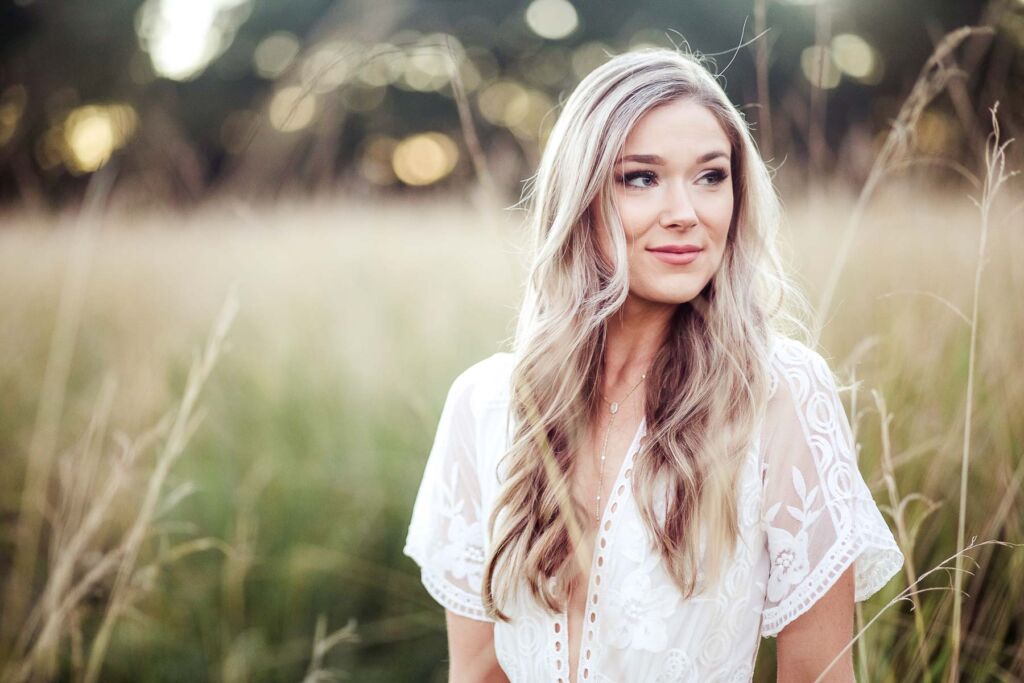 engagement portrait of boho bride in field