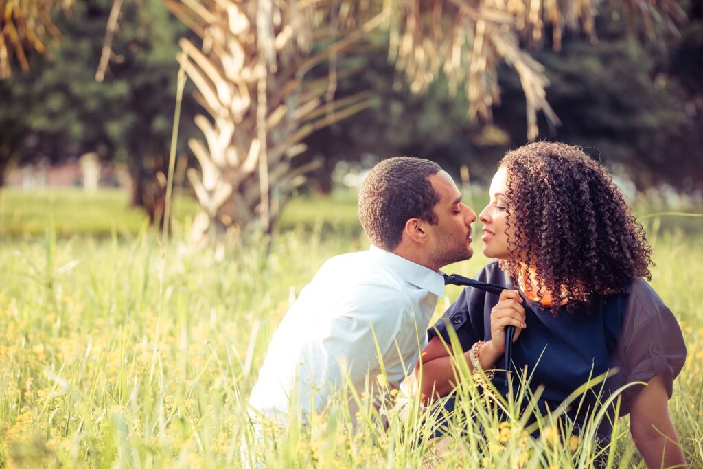 Engagement photo of black couple about to kiss
