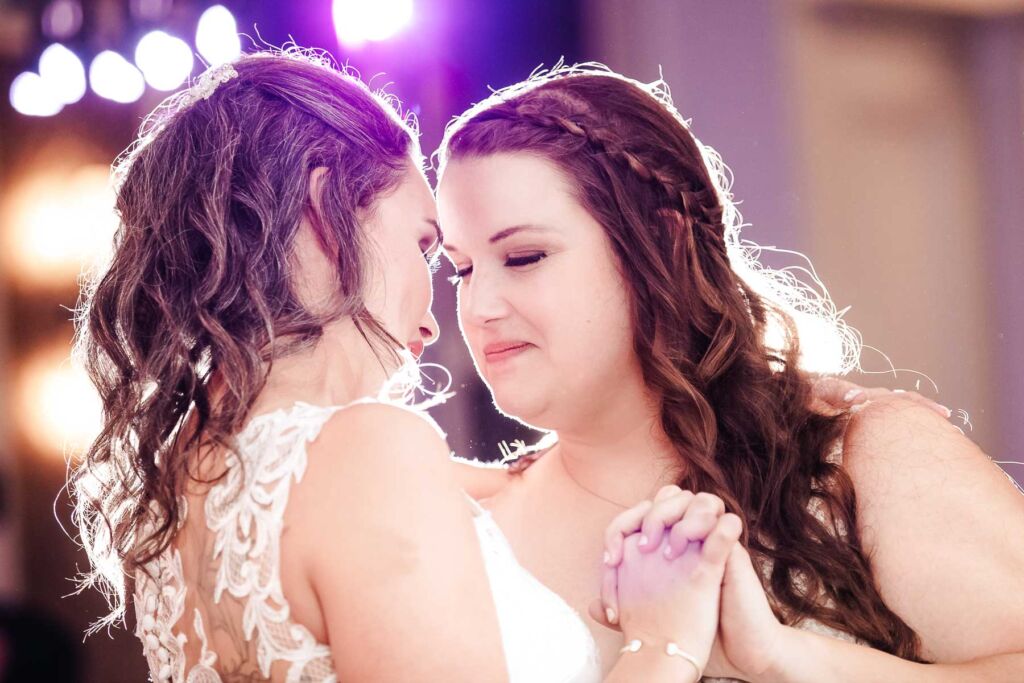 Two brides first dance at wedding reception