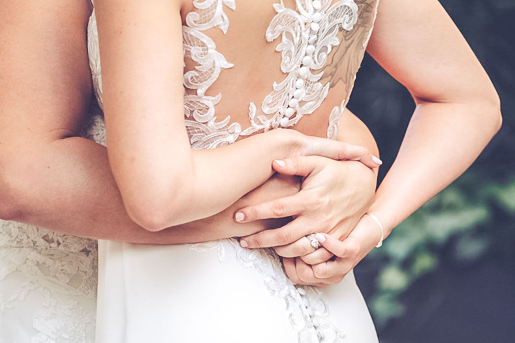 two brides lovingly embrace