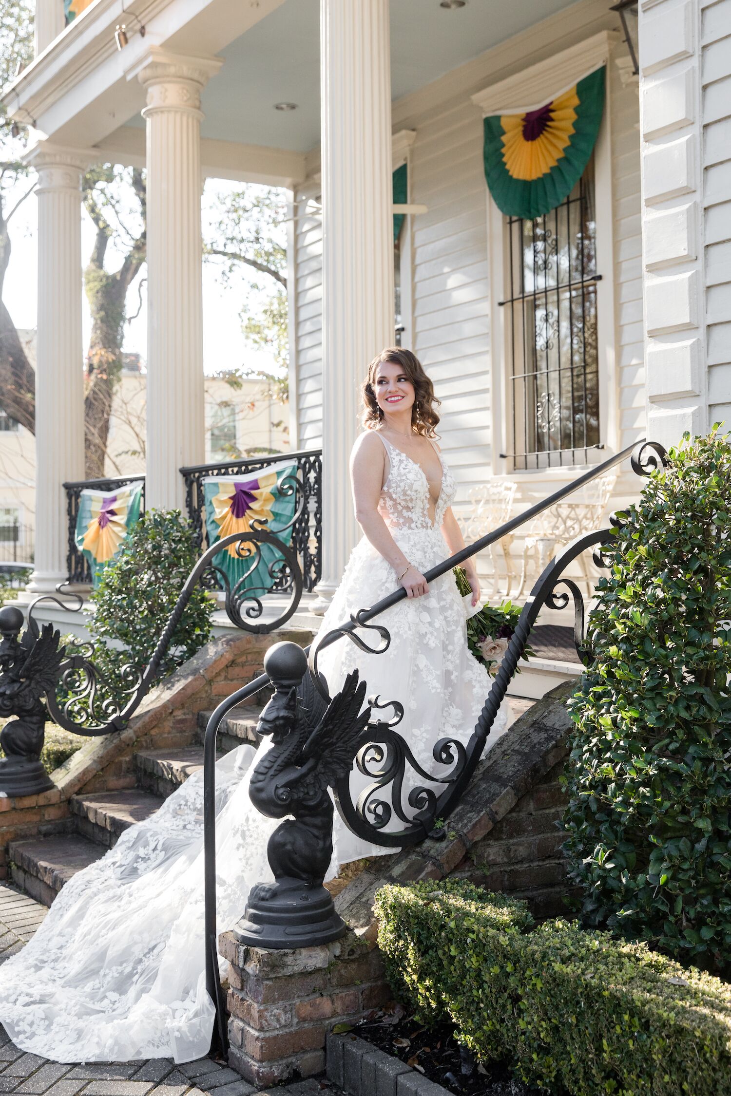 Smiling bride on front steps of The Elms Mansion
