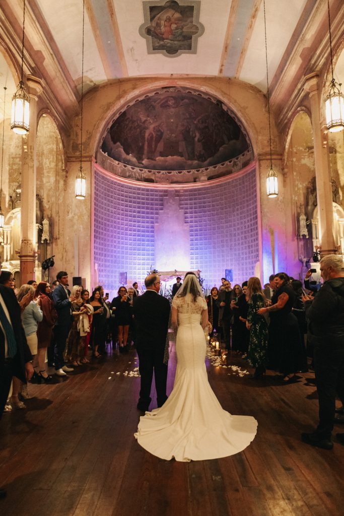 Bride and her father walk down the aisle at Hotel Peter & Paul Church in New Orleans